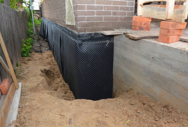 SJ Waterproofing Pros technician performing targeted Waterproofing assessment in McComb, OH
